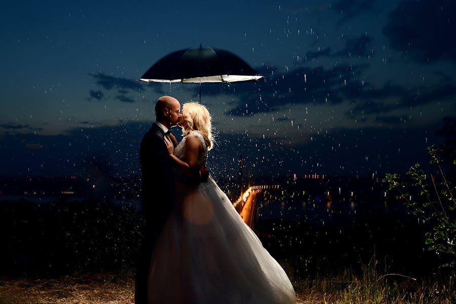 rainy wedding photo session with umbrella shot