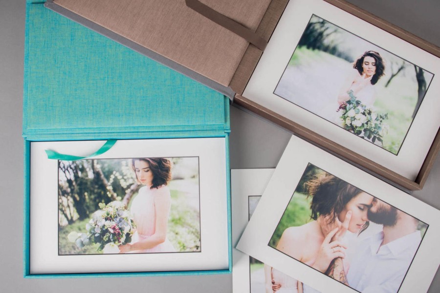 Matted prints of a married couple inside and outside the Folio Box