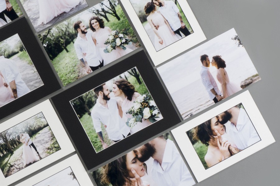 Photo prints of newly married couple embracing each other