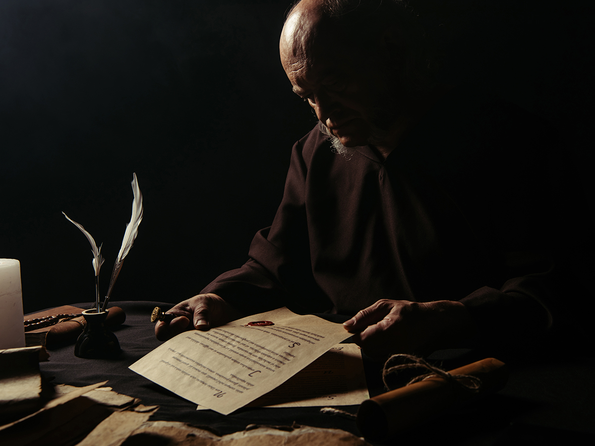 depiction of a monk working on a manuscript