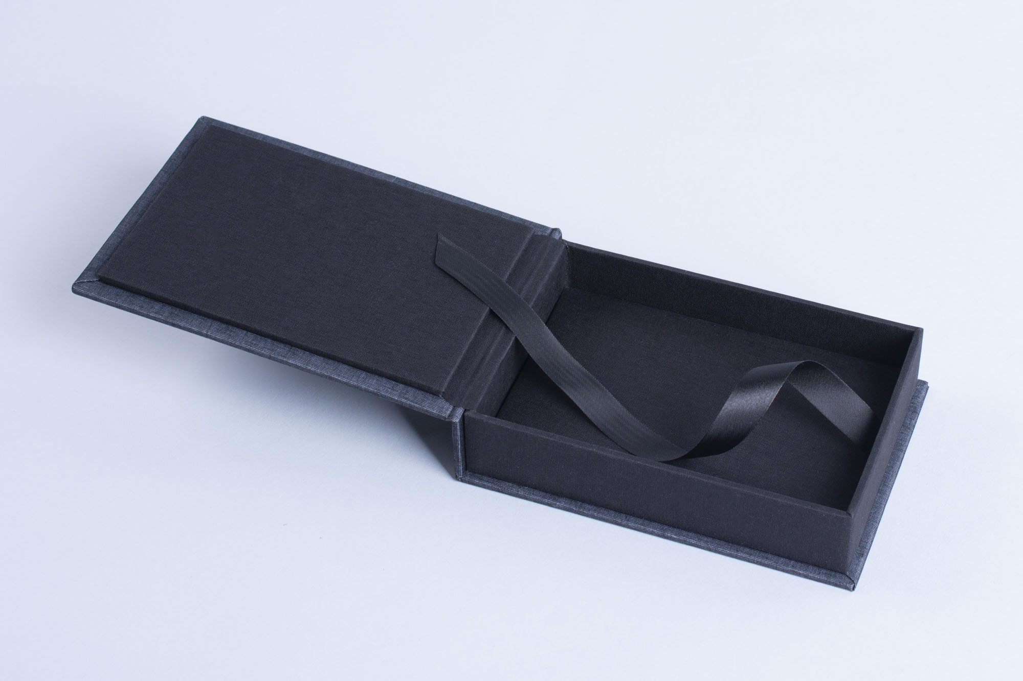 Black empty photo prints case with lift ribbon