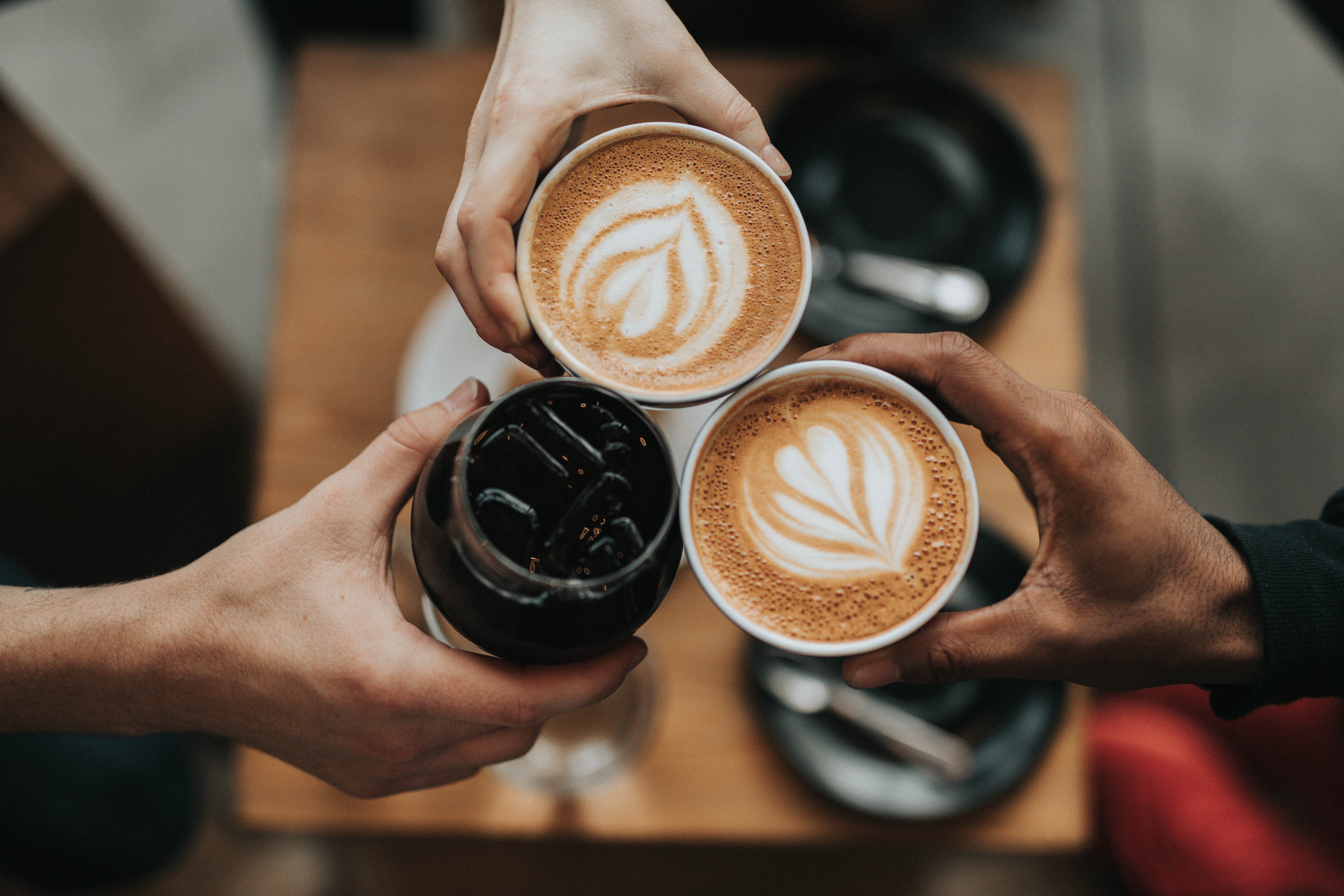 Three cups of coffee with hearts