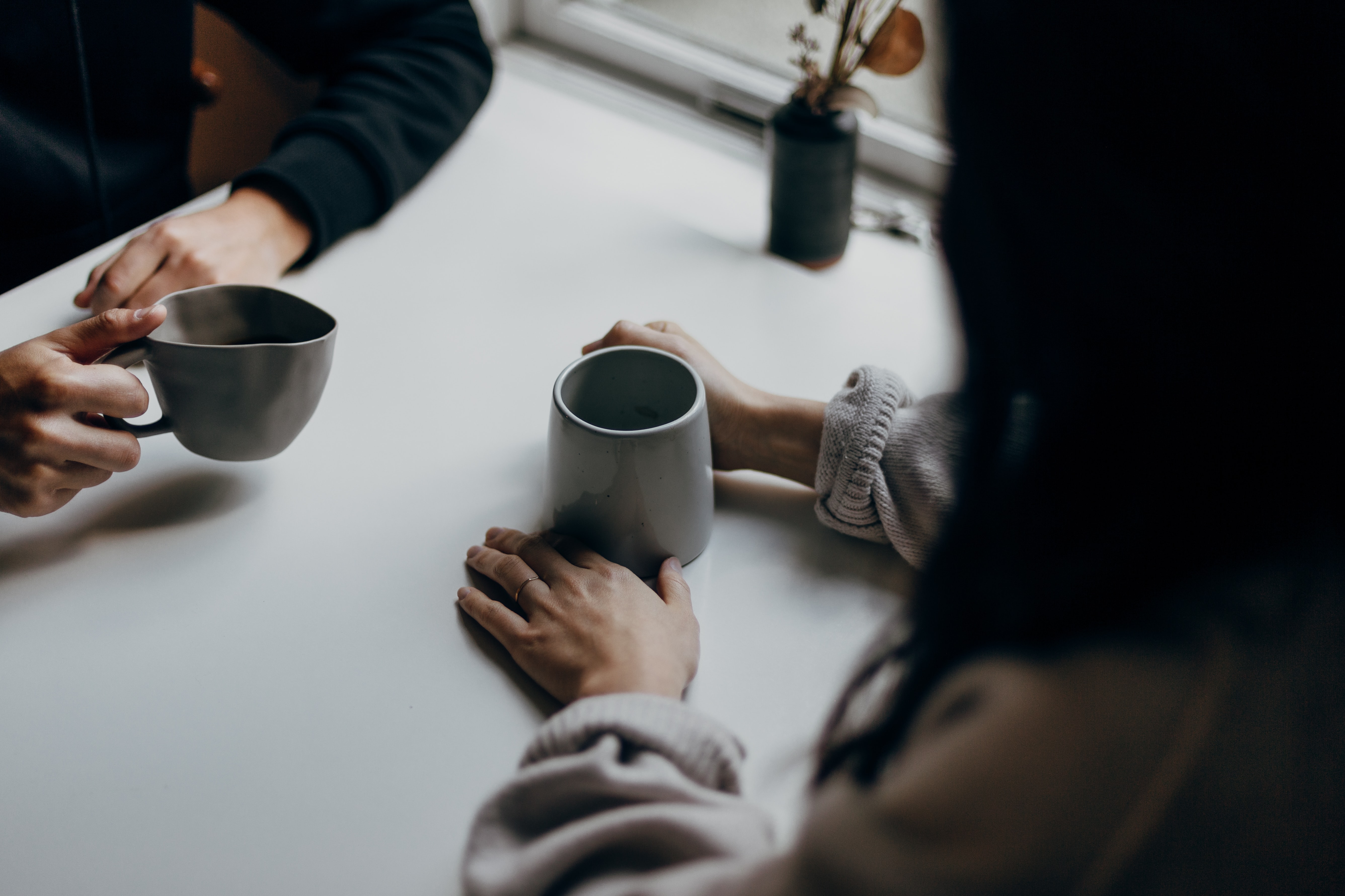 Coworkers drinking coffee together