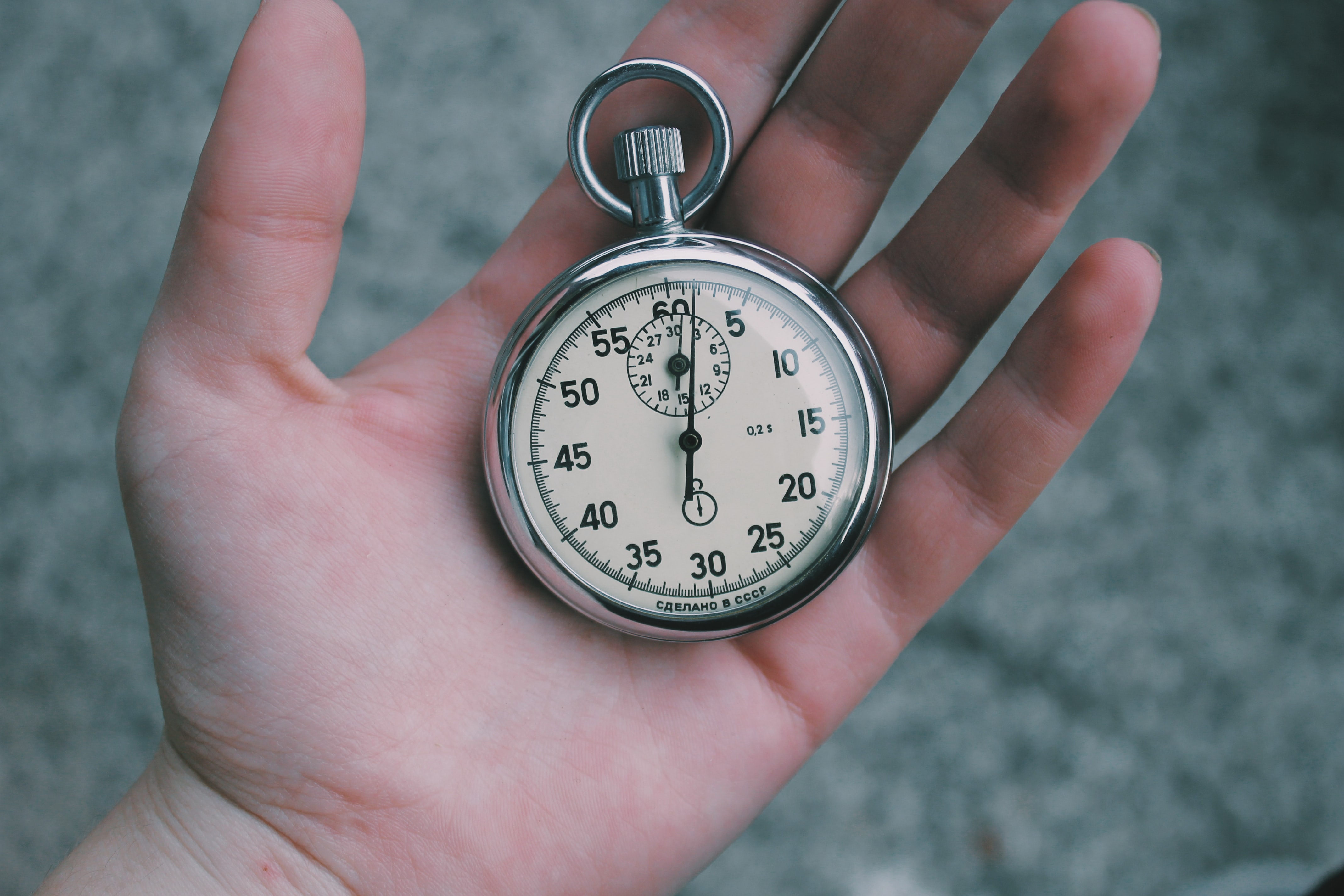 Close-up on a hand and pocket watch